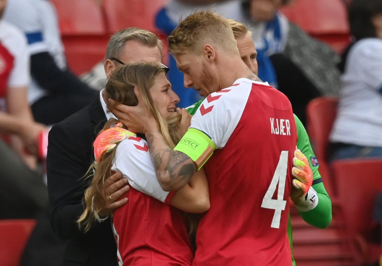 Simon Kjaer and Kasper Schmeichel comforted Christian Eriksen's partner on the pitch after the incident